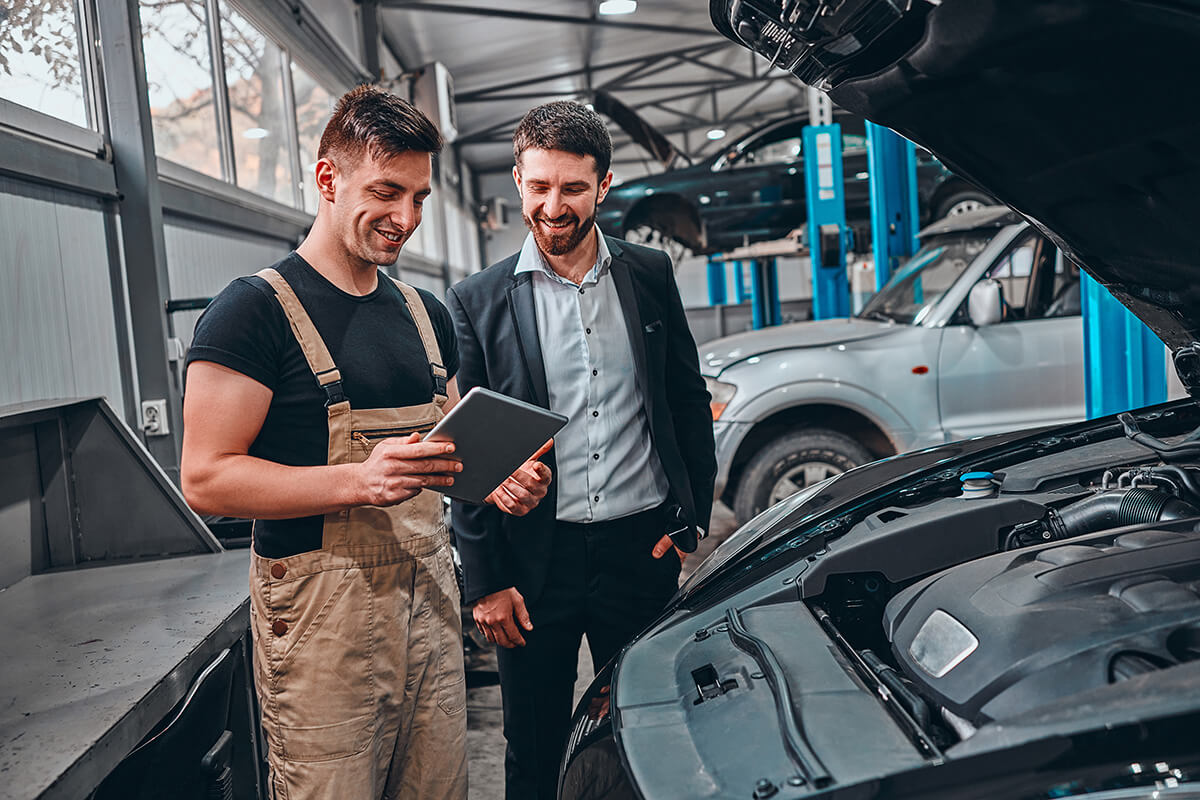 Customer listening to his mechanic