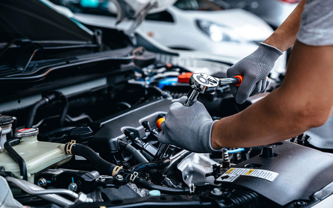 Mechanic using wrench