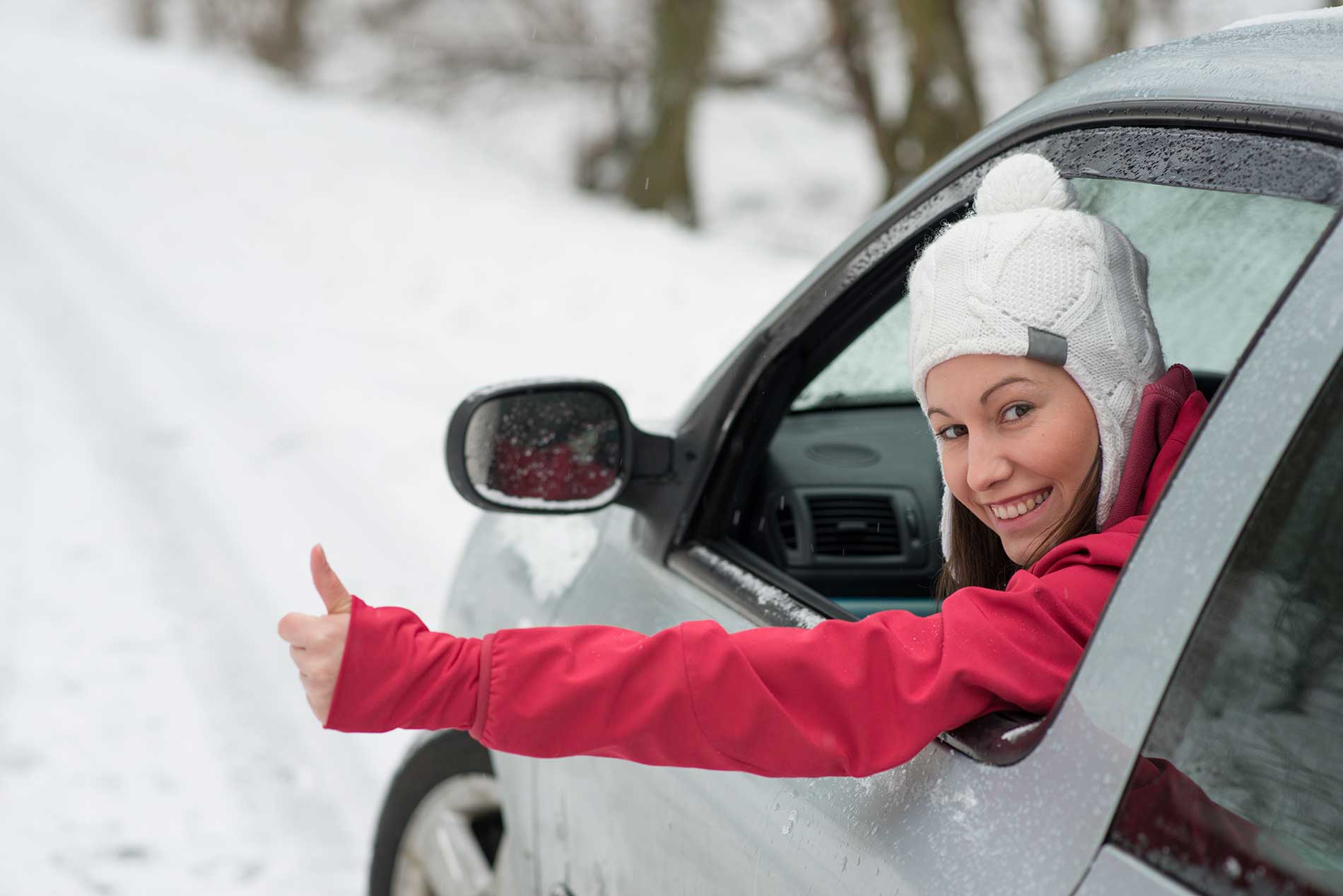 driver-with-a-thumbs-up-while-in-the-car