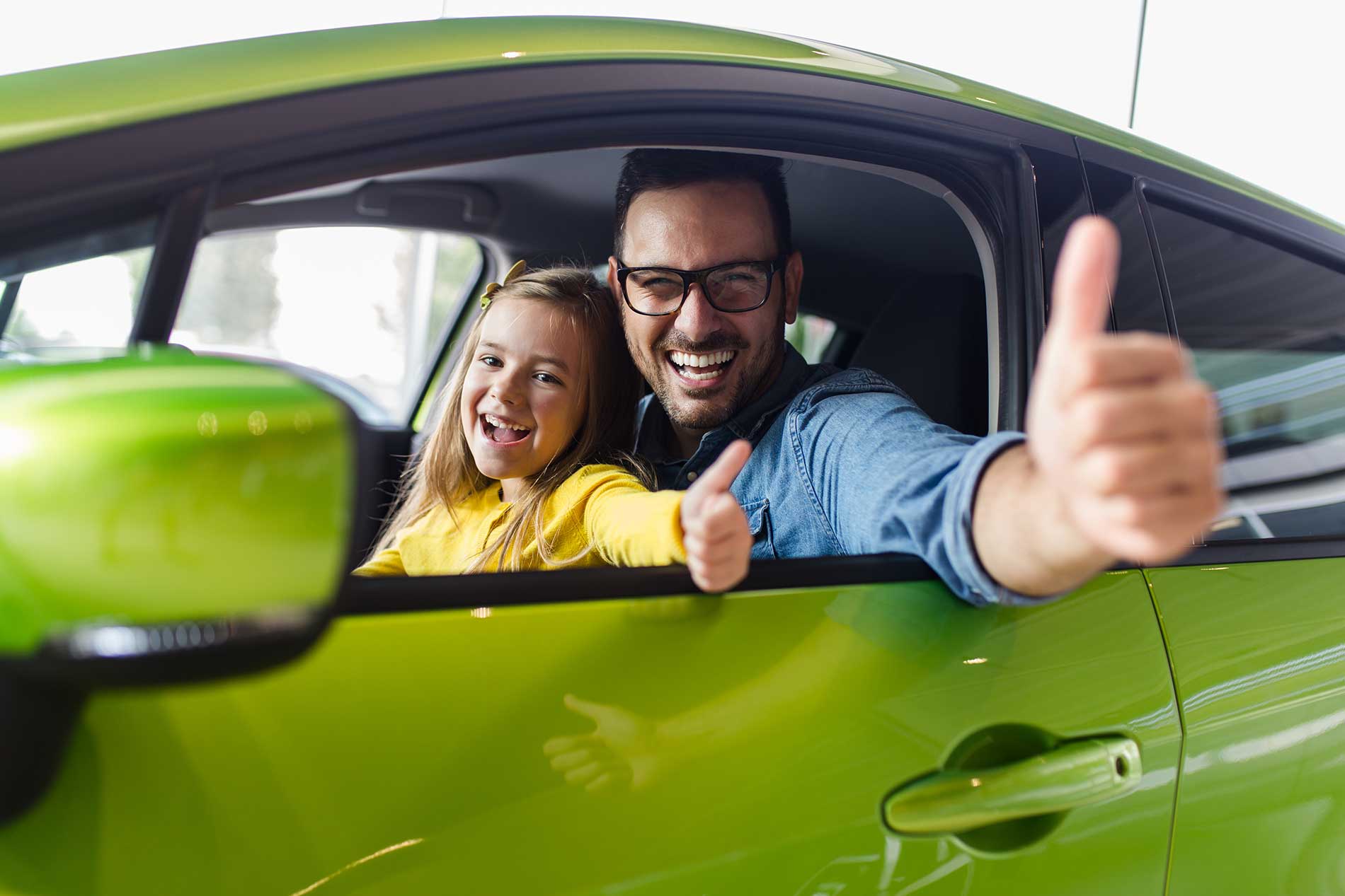 father-and-daughter-driving-together-in-a-car