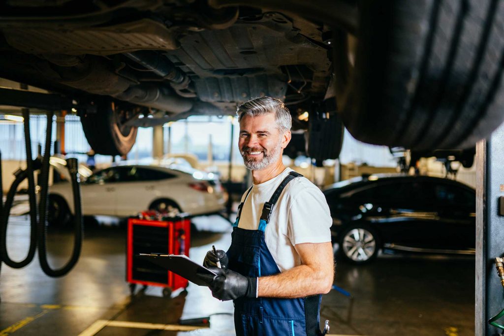 mechanic doing evaluations on the vehicle