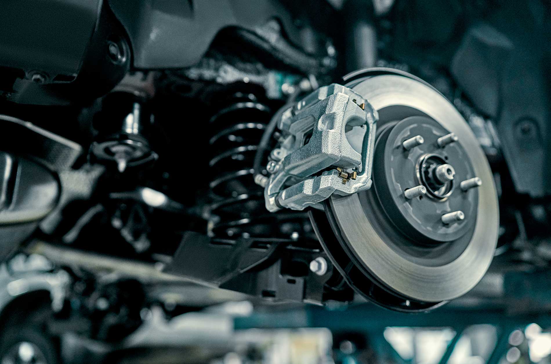 technicians working on brake pads